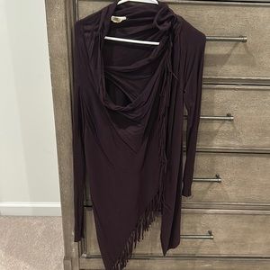 Plum colored sweater. Botton in top left corner by the clavicle.